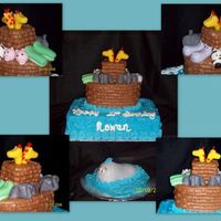 Noah's Ark First birthday cake, fondant animals, buttercream icing. Ark is Wilton oval pan (comes in the course 2 kit) with a square cut out of scraps...