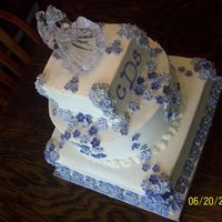 Lavender Flowers This was buttercream icing with 3 shades of lavender RI violets, apple blossoms and periwinkle. Monogram was also RI.