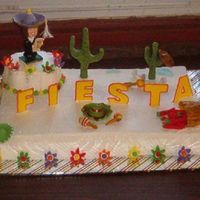 "fiesta" Theme College Grad Cake Everything on the cake is edible except the graduation girl. I cut the original mortar board off and replaced it with a sombrero., painted...