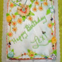 Cakelong.jpg Everything on the cake is edible except of course the candles and "Tinkerbell" Butterflies are made with rice paper, an...