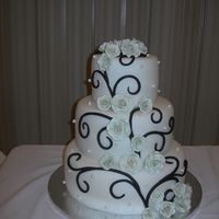 Ana's Cake Variation on a theme. Chocolate fondant swirls with light sage gumpaste roses.