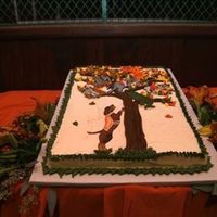 Ut Groom's Cake - Get Em Smokey Orange/white marble cake, grand marnier buttercream base icing, mascots are flood icing pieces, leaves, tree, and border are buttercream.