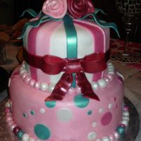 Sarah's Engagement Cake Almond butter cake with almond buttercream, covered in fondant. Roses are fondant, bows and ribbons are gumpaste, all are brushed with...