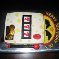 Slot Machine Cake Chocolate enhanced cake with vanilla buttercream and fondant accents. Coins are store bought. Inspired by a cake done by anna_bannana.