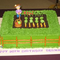 In The Garden Made for great aunt's 90th birthday. She still works her garden every day!! 50/50 figure and vegies, oreo dirt, pretzels for the fence...