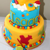 Airplane Birthday For my nephew's 1st birthday. Strawberry cake with vanilla buttercream. Covered in MMF. Airplane on top is RKT covered in MMF. (wings...