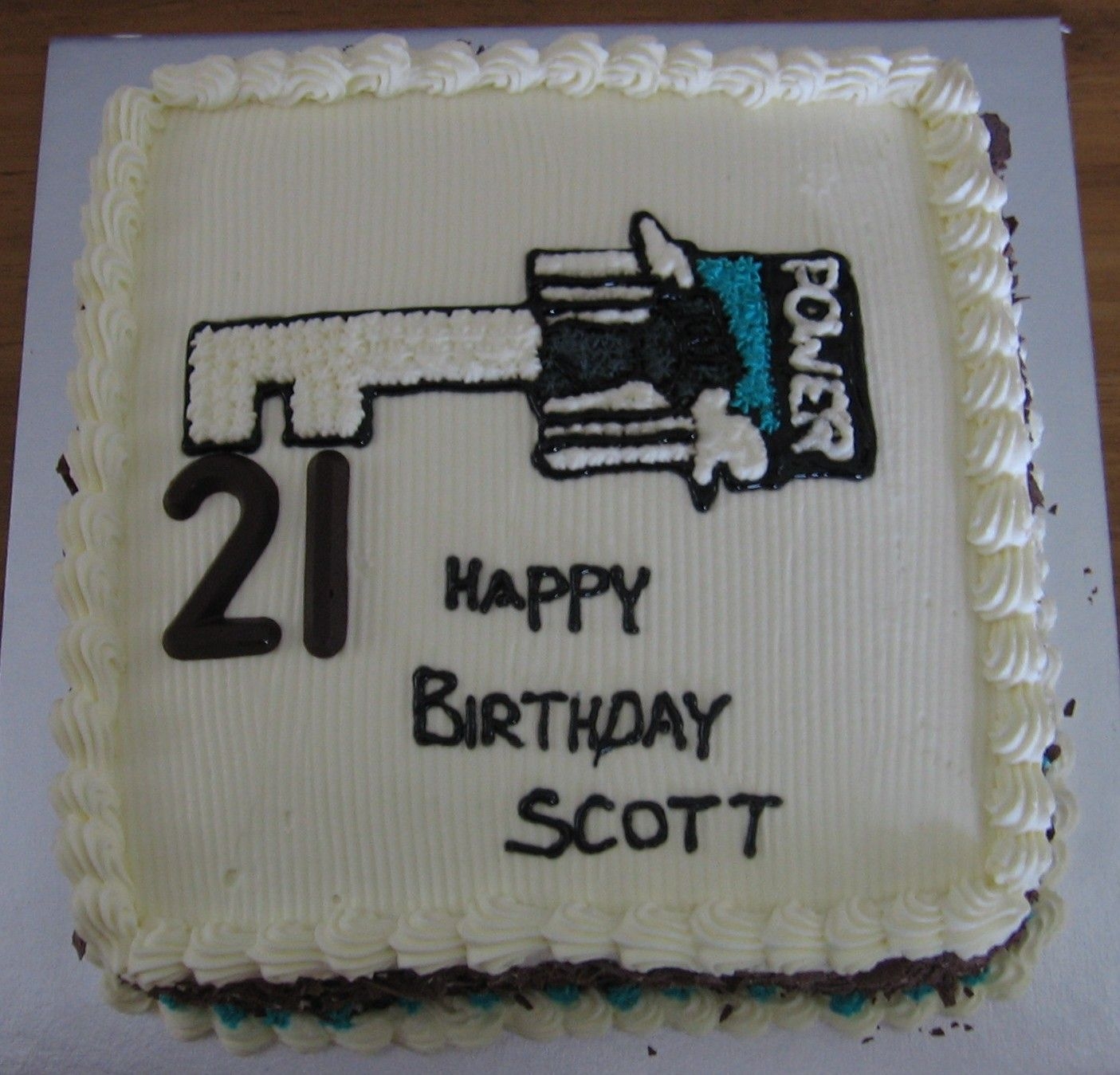 Port_Power_Cake_001.jpg I made this cake for my cousins 21st yesterday. Its a choc sponge with choc mousse filling. Fresh cream icing with a rice paper template...