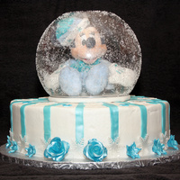 Winter Minnie Mouse In A Snow Globe Baby's first birthday cake. 12" yellow cake with butter cream frosting. Fondant flowers, stripes, and snowflakes that were...