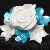 Blue And White Flower Bouquet Mini bouquet of roses and hyachthins (spell ?), and pulled flowers made out of fondant and airbrushed to achieve color