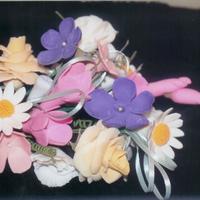 Flower Bouquet My first gumpaste flower bouquet that I learned in class. Roses, daisies, violets, & freesia. The class was fun and the teacher was...