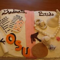 Wedding/graduation Cake This is for our student worker. She was graduating and getting married both this summer and we wanted to celebrate both. It is a book...