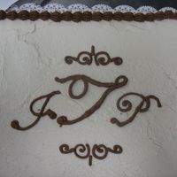 Monogram Chocolate cake, buttercream, with chocolate monogram.