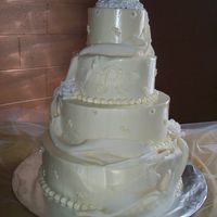 My First Fondant Drape Mexican paste roses/cake topper. Fondant (MMF) drape with gold luster dust highlighting the folds and royal icing pin dots on the drape....