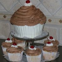 Giant Cupcake Used Wilton's giant cupcake pan. Banana cake w/chocolate & vanilla bc.
