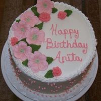 Birthday 8" yellow almond sour cream cake w/Sugarshack's buttercream recipe. RI and fondant flowers.