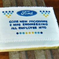 Corporate Cake Ford logo is a FBCT. 1/2 white cake, 1/2 chocolate. Had a heck of a time coming up with a design for this. Wanted it to look "...