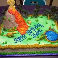 Dinosaur Theme I made this cake for my sons 2nd birthday. We put the candle on top of the volcano