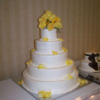 June Wedding This 5 tier cake was done in butter cream icing and accented with fresh flowers.