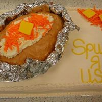 Bake Potato Cake I made the baked potato from a football pan and placed on top of a sheet cake. I cut a slit in the potato and took some cake out for the...