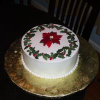 Winter Celebration Cake Gumpaste leaves and poinsetta made with petalpaste and crystal colors...buttercream technique via Sugarshack's video!