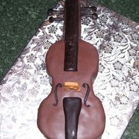 Cello Cake My first shaped cake, and my first experience with molding chocolate. This is a freebie for a friend (I do not charge for cakes), for his...