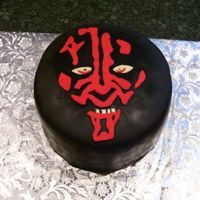 Darth Maul This is for my three boys, who LOVE the Starwars characters. Four layer yellow buttercake with chocolate buttercream and covered in black...