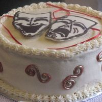 Red Velvet Birthday Cake For A 16 Year Old Girl The cake is a 4 layer red velvet cake with ivory cream cheese frosting. The masks on top are chocolate relief designs and the scrolls on...