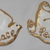 Doves Dove cookies with royal icing and gold dust brushed on.