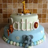 Jungle Animals Cake I'm a beginner and was VERY nervous about this cake ~ this was my first stacked cake and my third attempt in using fondant. I made it...