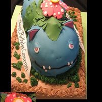 Pokemon Venusaur Birthday Cake My son loves Pokemon and wanted this for his 9th birthday. Base is Dark Choclate Fudge filled with chocolate pudding with chocolate icing....