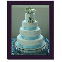 Blue & Silver very simple covered in fondant with silver edible pearls and a blue ribbon.