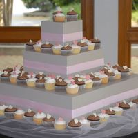 First Cupcake Tower We did this cupcake tower instead of the groom's cake with 1/2 vanilla and 1/2 chocolate cupcakes, with coordinating chocolate or...
