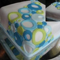 Circles Just a cake I did up for a potluck dinner. Nothing fancy just some cool green, and blue fondant circles.