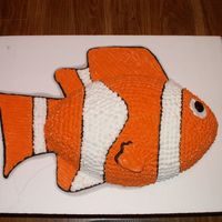 Nemo Used the football pan for his body. Fins and tail drawn with buttercream onto the cake board.
