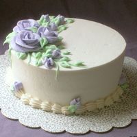 Purple Roses Just practicing getting my sides smooth for an upcoming wedding cake. Buttercream icing.