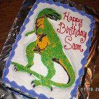 Dino Cake This was my first attempt at a frozen buttercream transfer. The cake was for my son's 3rd birthday.