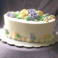Purple And Yello Roses Buttercream icing. Just some practice. :o)