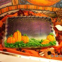 Twilight Pumpkin Patch Buttercream icing. background airbrused with edible paints. Pumpkins done with buttercream.