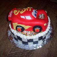 Evyn's Cake All fondant. Carved the car from a 10 inch round. Base is a 12 round.