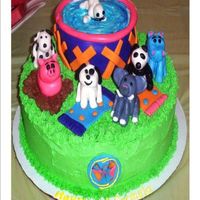 Carmela's Webkinz Cake This is a 10 inch round with a 6 inch round pool with BC frosting, fondant accents and figurines! This was my first time making figurines,...