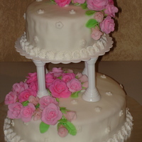 Tiered Cake This is my first tiered cake for wilton class....fondant bumpy but love my roses