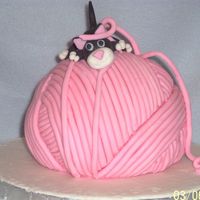 Lil' Kitten's Big Dream This is my attempt at one of Debbie Brown's cakes. I used the Wilton sportsball pan. Yellow with buttercream and mmf. Instead of...