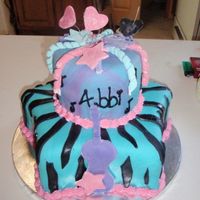 Hannah Montana Star pan on bottom done in fondant with zebra stipes and marbled fondant on top