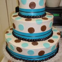 Teal And Brown Polka Dots Ivory butter cream with teal and brown fondant polka dots and teal and brown ribbon