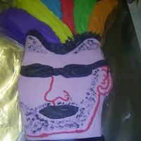 Punk Rock Cake This was a cake I made for my son's punk rock bday party. It was really difficult to get the hair right. It's a somewhat mohawk...