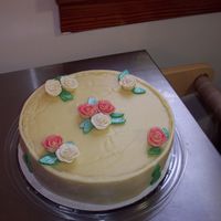 White Chocolate Cheesecake With Chocolate Clay Roses This is a white chocolate cheesecake with a white chocolate ganache decorated with white chocolate modeling clay roses brushed with pearl...