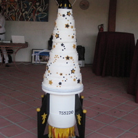 Rocket Wedding Cake Cakes are chocolate, french vanilla, lemon and red velvet. Fondant covered.Very challenging!
