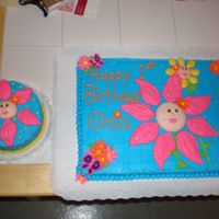 Baby-Faced Flower Smash Cake Here's the smash cake with the main cake already posted. Baby faces are marshmallow fondant.