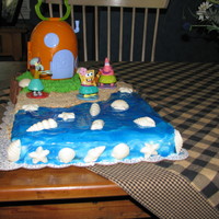 Spongebob Luau Sheet cake, round cake BC Frosting, crushed vanilla waffers for sand, white chocolate shells,