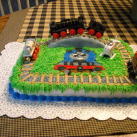 Thomas And Friends My grandson absolutely loves Thomas and wanted a Thomas cake, Choc cake with bc frosting, bridge is fondont